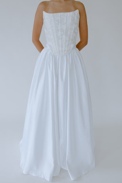 White wedding corset and skirt set on a plain background