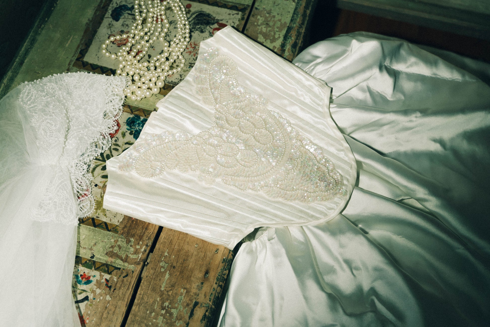 White wedding corset with lace and pearl necklace